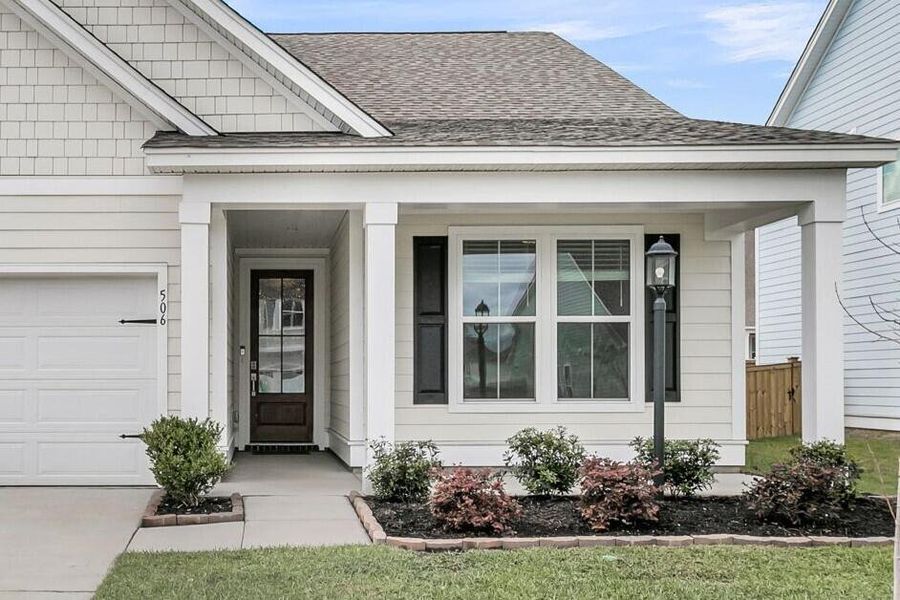 Exterior details and patio area of a home in High Point at Foxbank, Moncks Corner (Image 34).