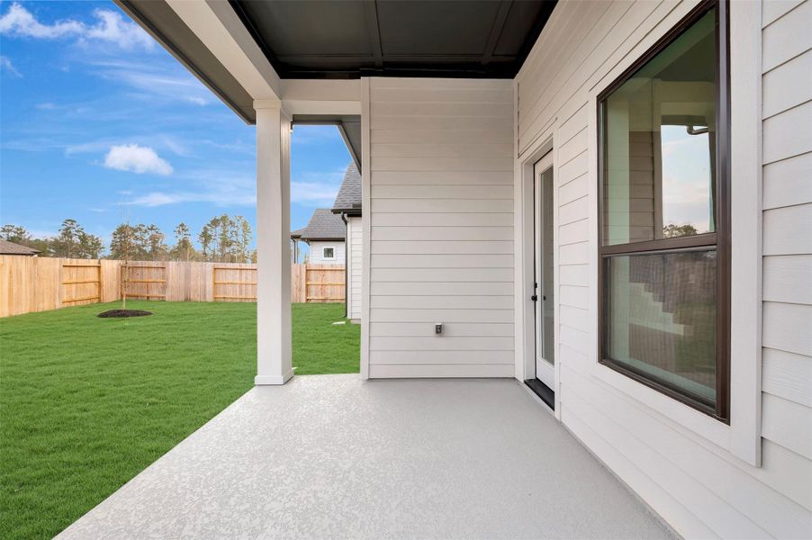 Exterior details and patio area of a home in ARTAVIA 50' Homesites, Conroe (Image 27).