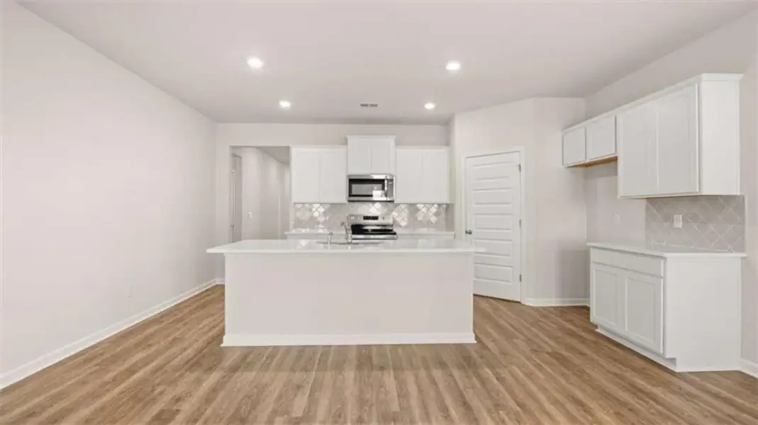 Furnished interior view inside a new home in Oakchase at Hampton, Hampton (Image 5). Furnished interior view inside a new home in Oakchase at Hampton, Hampton (Image 5).