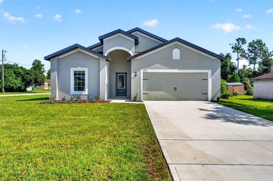 Front exterior of a new home in , Deltona, FL, highlighting curb appeal (Image 19). Front exterior of a new home in , Deltona, FL, highlighting curb appeal (Image 19).