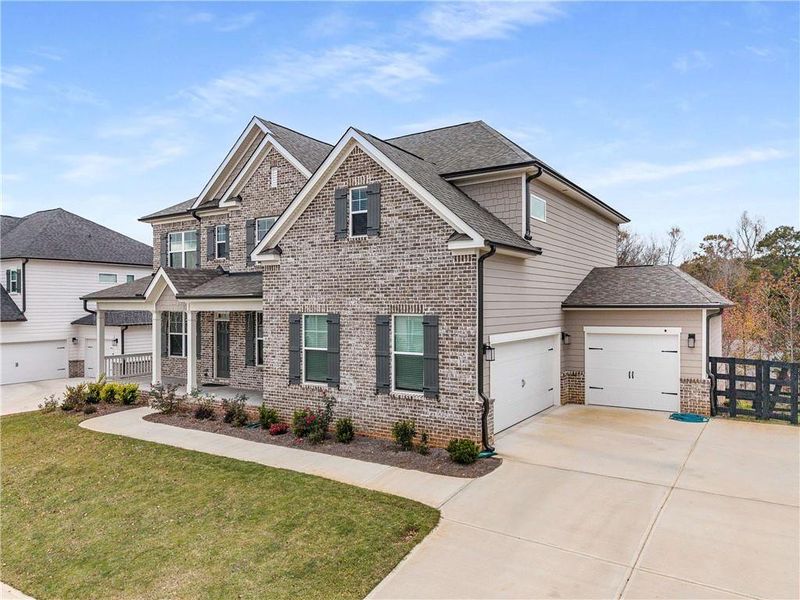 Front exterior of a new home in Carmichael Farms, Canton, GA, highlighting curb appeal (Image 25).