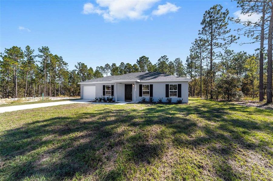 Front exterior of a new home in , Dunnellon, FL, highlighting curb appeal (Image 23). Front exterior of a new home in , Dunnellon, FL, highlighting curb appeal (Image 23).