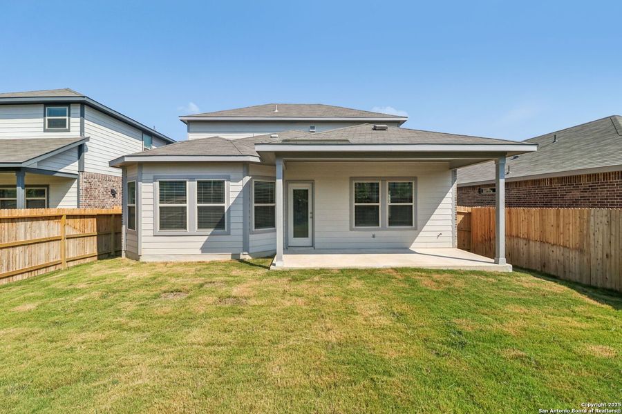 Front exterior of a new home in Comanche Ridge, San Antonio, TX, highlighting curb appeal (Image 28). Front exterior of a new home in Comanche Ridge, San Antonio, TX, highlighting curb appeal (Image 28).