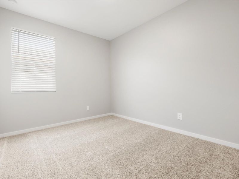 Spacious, unfurnished interior of a new home in Blossom Rock Reserve Series, Apache Junction (Image 15).