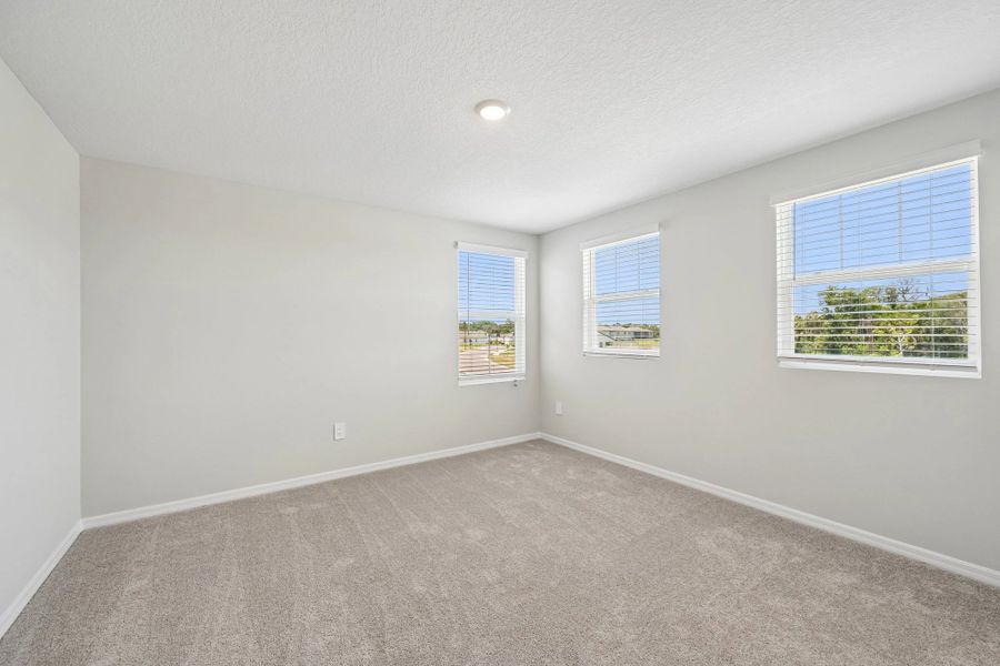 Bedroom 3 features three windows for great natural light