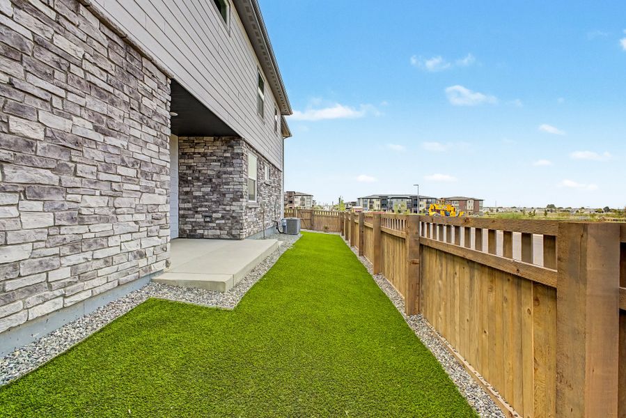 Exterior details and patio area of a home in Painted Prairie, Aurora (Image 4).