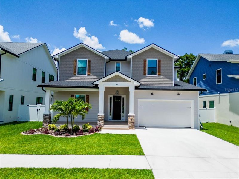 Front exterior of a new home in , Tampa, FL, highlighting curb appeal (Image 1).