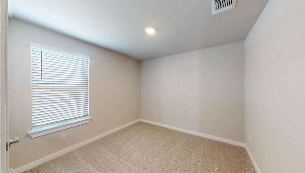 Spare room with carpet floors and baseboards