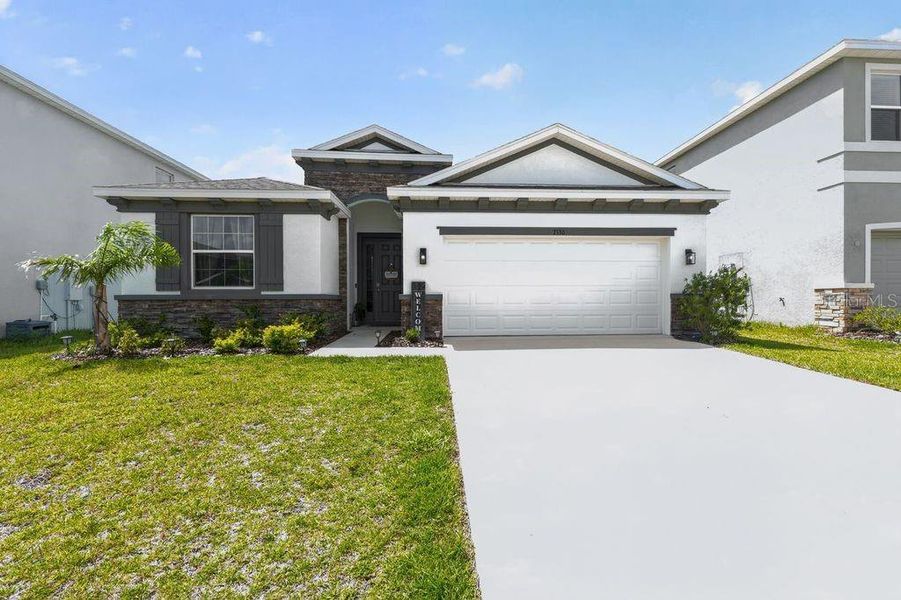 Front exterior of a new home in Waterford, Brooksville, FL, highlighting curb appeal (Image 25).
