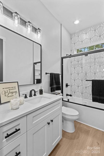 Bath 2 with tiled shower.