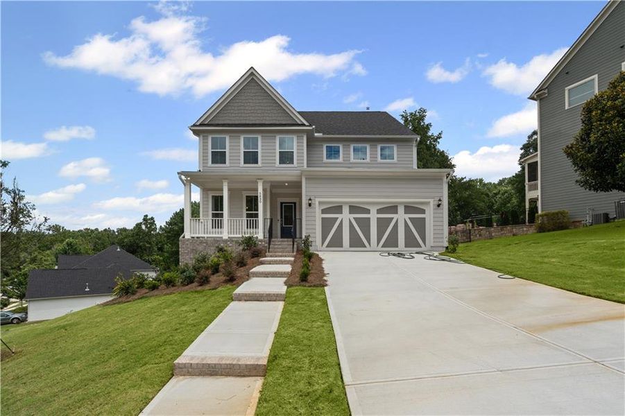 Front exterior of a new home in Reunion, Hoschton, GA, highlighting curb appeal (Image 21).