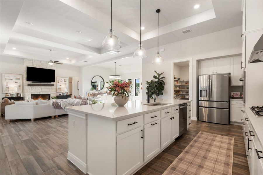 A spacious, naturally illuminated kitchen and living area flows seamlessly for modern living. A spacious, naturally illuminated kitchen and living area flows seamlessly for modern living.
