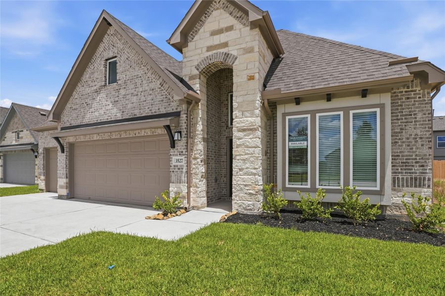 Front exterior of a new home in Foxtail Palms, Manvel, TX, highlighting curb appeal (Image 21).