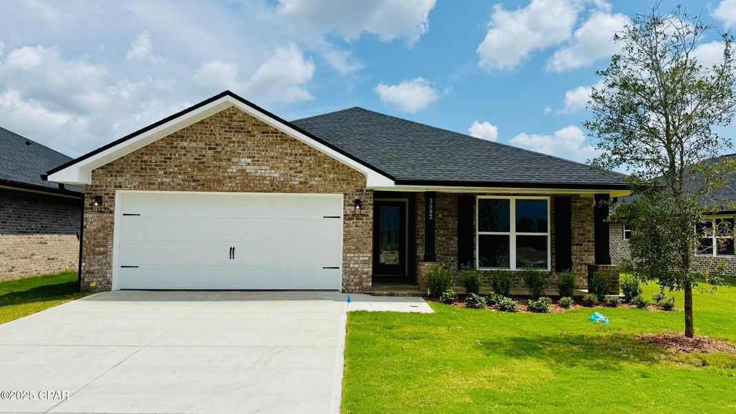 Front exterior of a new home in College Station, Panama City, FL, highlighting curb appeal (Image 1). Front exterior of a new home in College Station, Panama City, FL, highlighting curb appeal (Image 1).