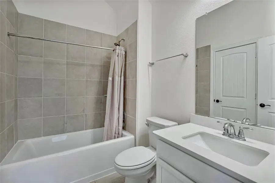 Furnished interior view inside a new home in Harper's Preserve - Classic Series, Conroe (Image 4). Furnished interior view inside a new home in Harper's Preserve - Classic Series, Conroe (Image 4).