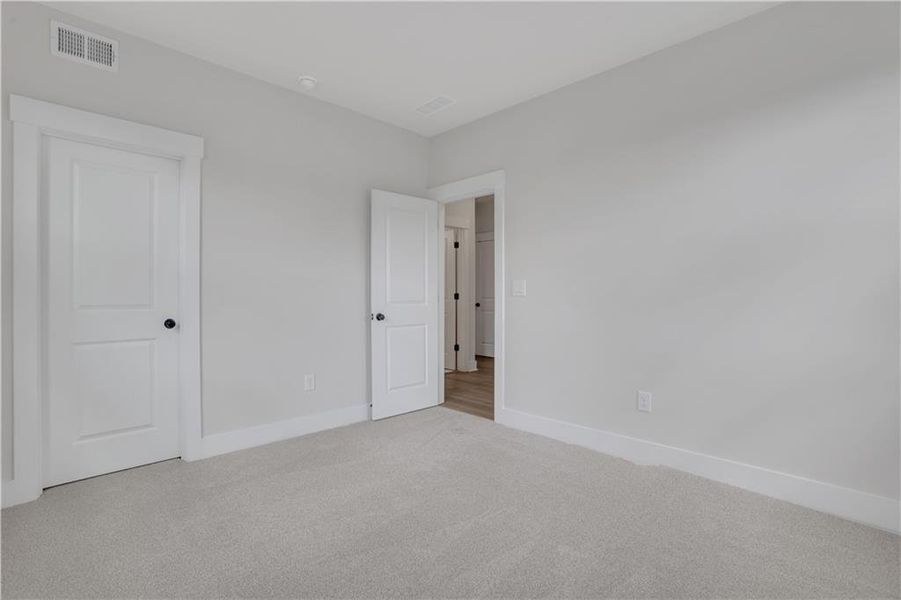 Spacious, unfurnished interior of a new home in The Paddocks at Doc Hughes, Buford (Image 44).