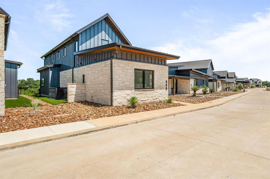 Front exterior of a new home in , Iredell, TX, highlighting curb appeal (Image 2). Front exterior of a new home in , Iredell, TX, highlighting curb appeal (Image 2).