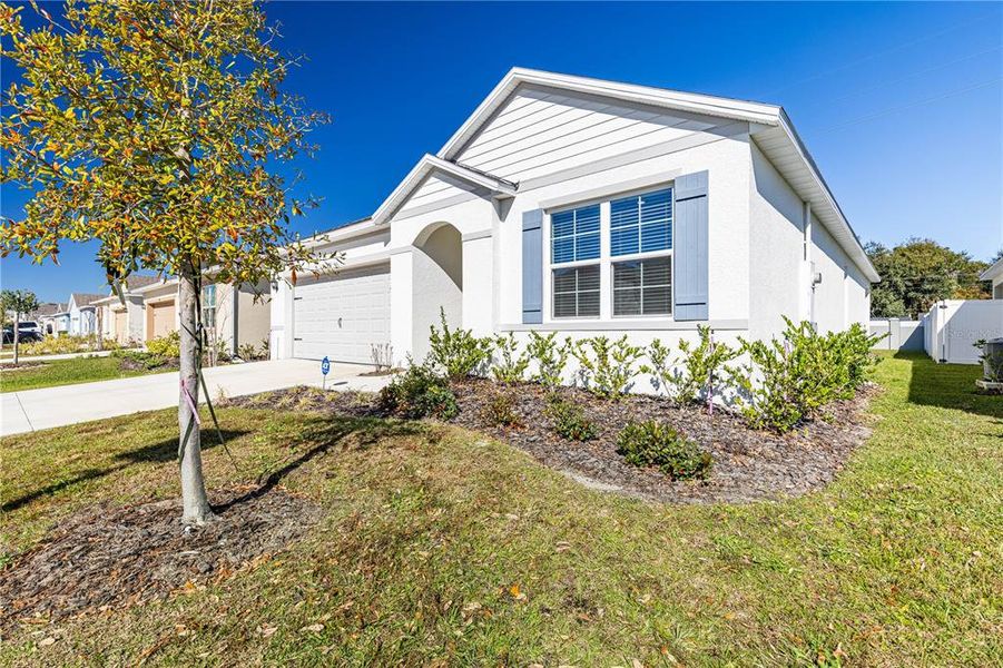 Front exterior of a new home in Magnolia Pointe, Umatilla, FL, highlighting curb appeal (Image 2).