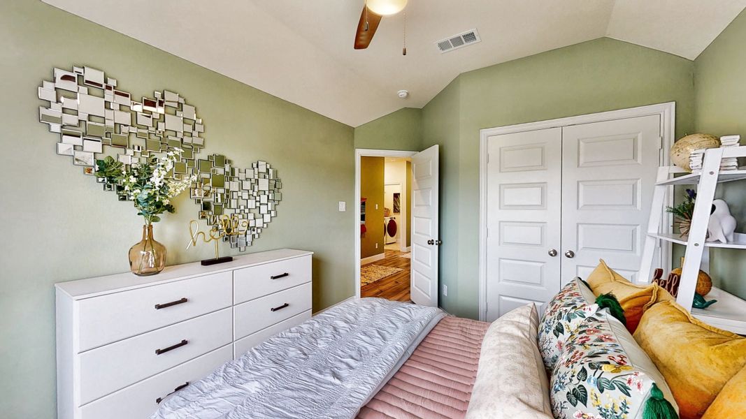 A bedroom with a bed and a dresser. A bedroom with a bed and a dresser.