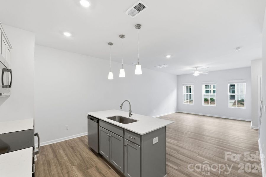 Kitchen with Quartz Countertops and soft-close cabinet doors