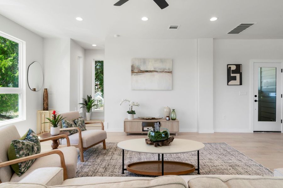 Living room featuring recessed lighting, wood finished floors, plenty of natural light, and a ceiling fan
