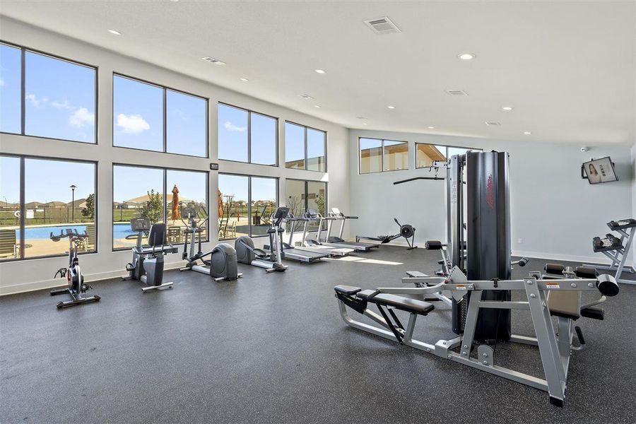 Gym with a water view and plenty of natural light