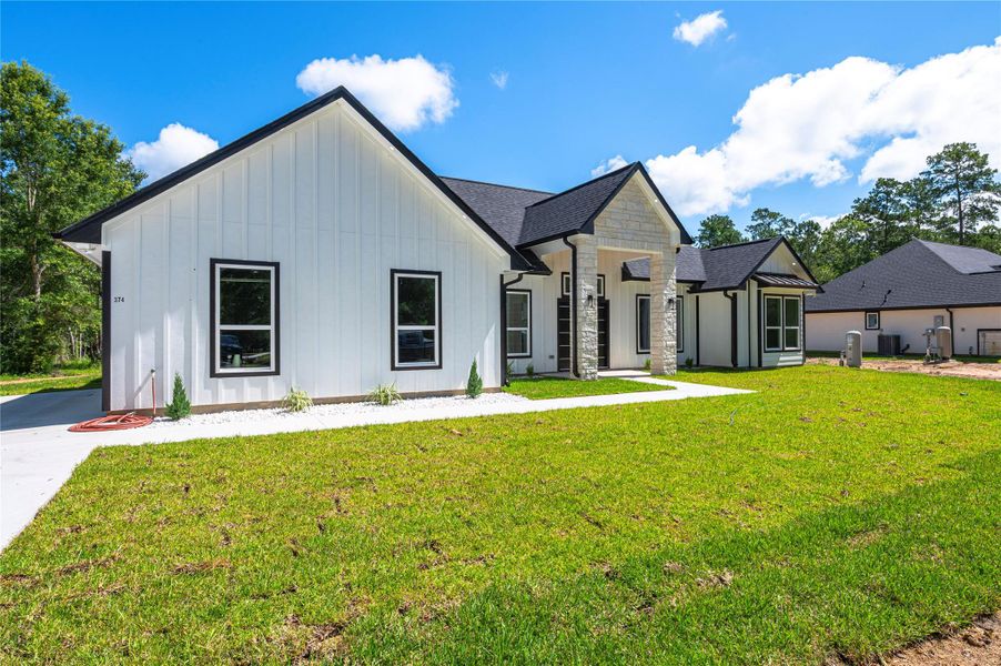 Front exterior of a new home in , Dayton, TX, highlighting curb appeal (Image 27).