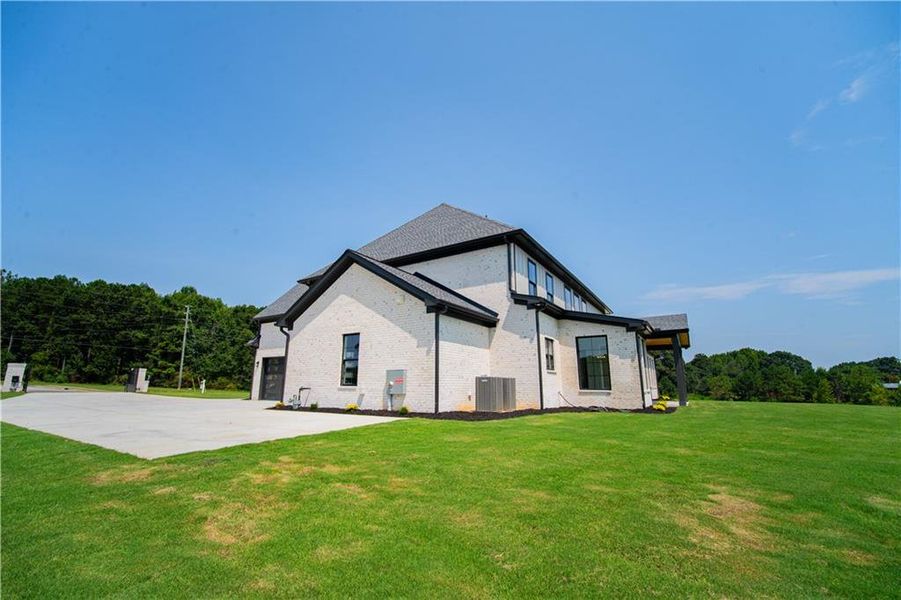 Front exterior of a new home in , Dacula, GA, highlighting curb appeal (Image 28). Front exterior of a new home in , Dacula, GA, highlighting curb appeal (Image 28).