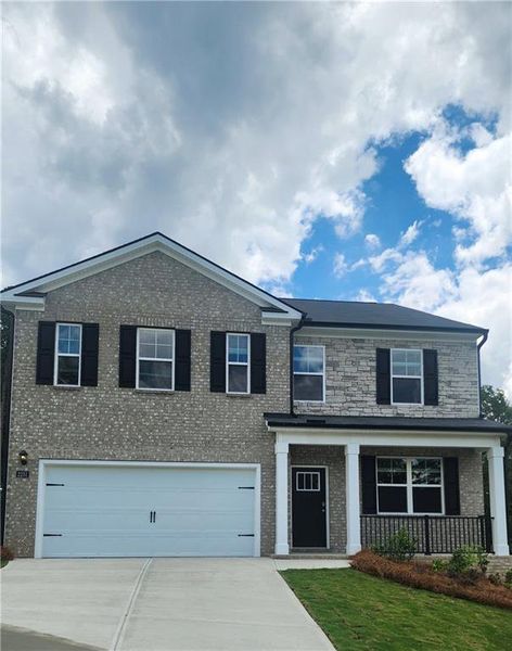 Front exterior of a new home in Brooks Station, Dacula, GA, highlighting curb appeal (Image 1). Front exterior of a new home in Brooks Station, Dacula, GA, highlighting curb appeal (Image 1).