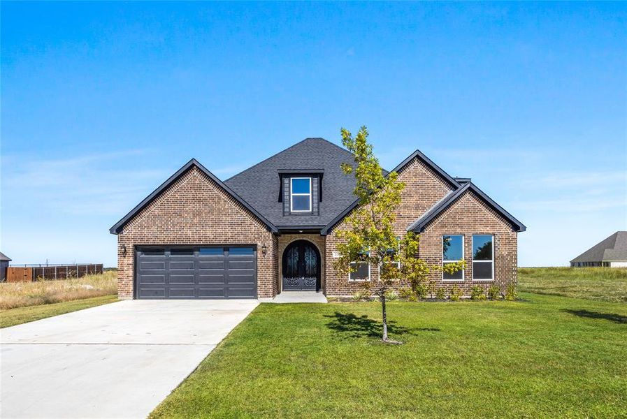 Front exterior of a new home in , Venus, TX, highlighting curb appeal (Image 17).