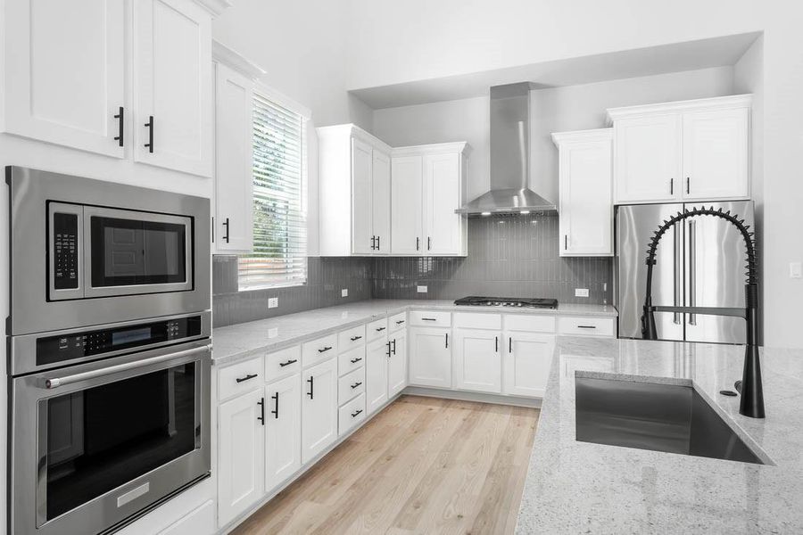 Gorgeous, open kitchen with all stainless steel appliances and plenty of counter space.