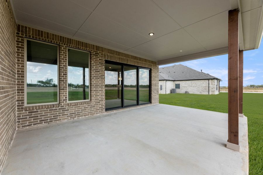 Exterior details and patio area of a home in Settler's Glen, New Fairview (Image 2). Exterior details and patio area of a home in Settler's Glen, New Fairview (Image 2).