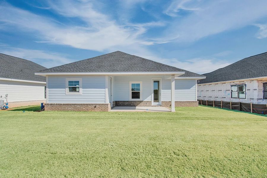 Front exterior of a new home in The Bluffs at Lafayette, Freeport, FL, highlighting curb appeal (Image 17). Front exterior of a new home in The Bluffs at Lafayette, Freeport, FL, highlighting curb appeal (Image 17).