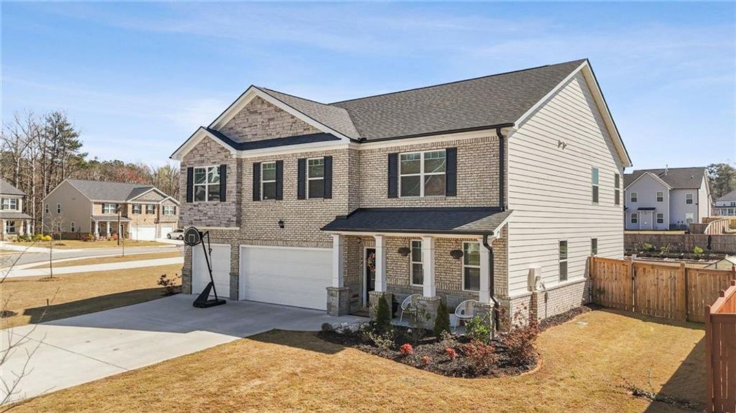 Front exterior of a new home in Independence, Loganville, GA, highlighting curb appeal (Image 27).