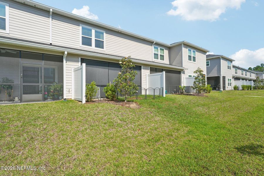 Exterior details and patio area of a home in Longbay Townhomes, Middleburg (Image 3).