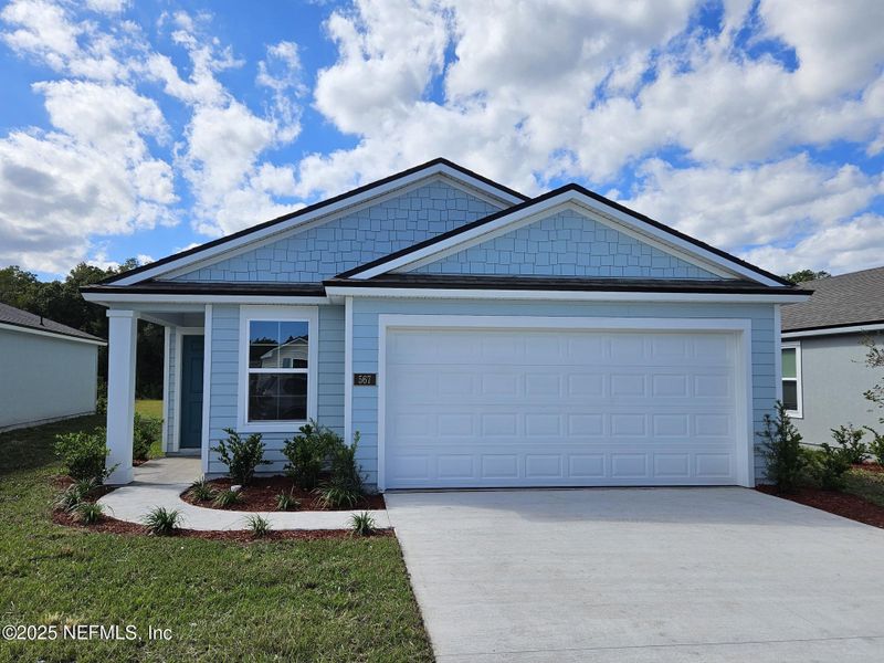 Front exterior of a new home in Entrada, St. Augustine, FL, highlighting curb appeal (Image 2). Front exterior of a new home in Entrada, St. Augustine, FL, highlighting curb appeal (Image 2).