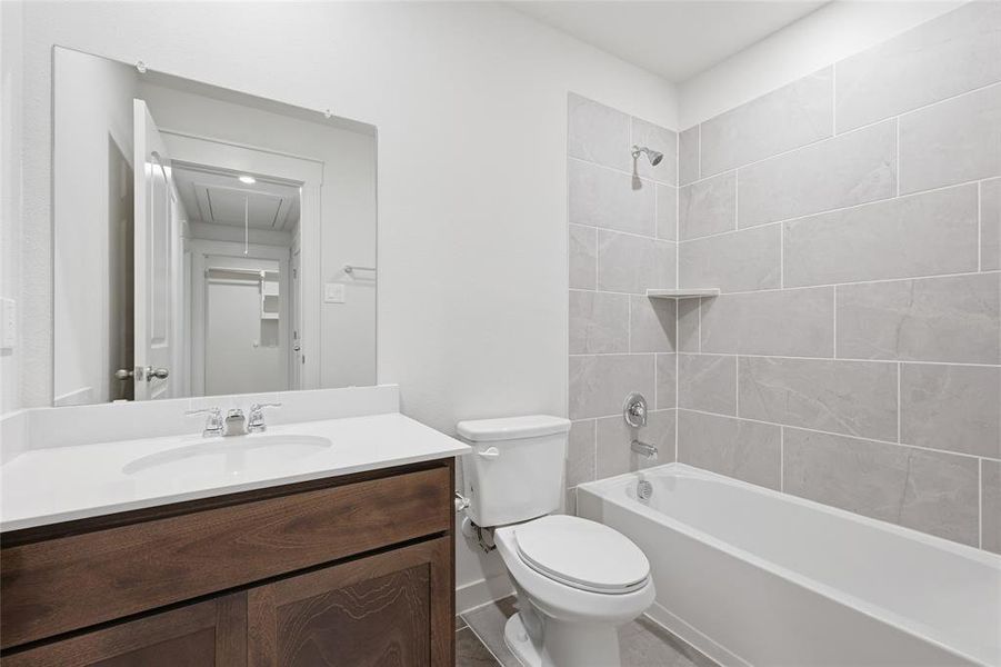 Bathroom featuring vanity and shower / bathtub combination
