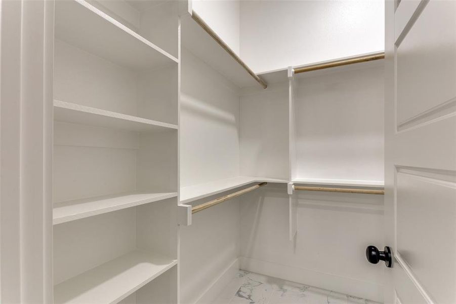 Spacious closet with marble finish floor