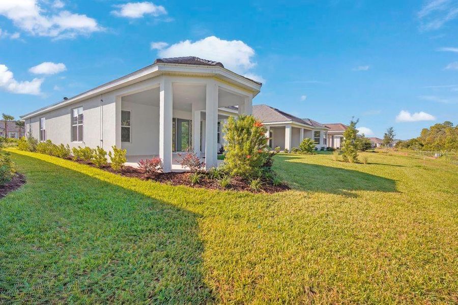 Exterior details and patio area of a home in Esplanade at Wiregrass Ranch, Wesley Chapel (Image 3).