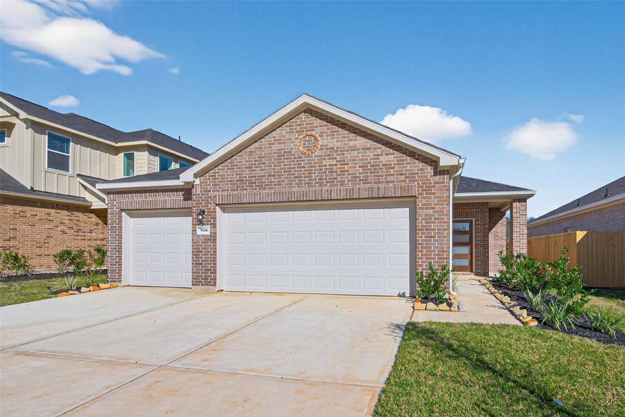 Front exterior of a new home in Enclave at Willis, Willis, TX, highlighting curb appeal (Image 18).