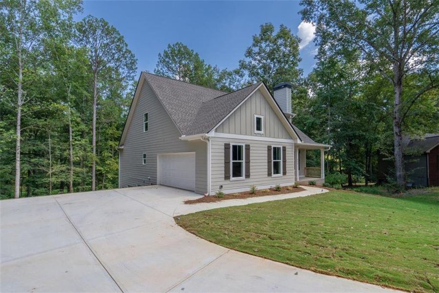 Front exterior of a new home in , Covington, GA, highlighting curb appeal (Image 27).