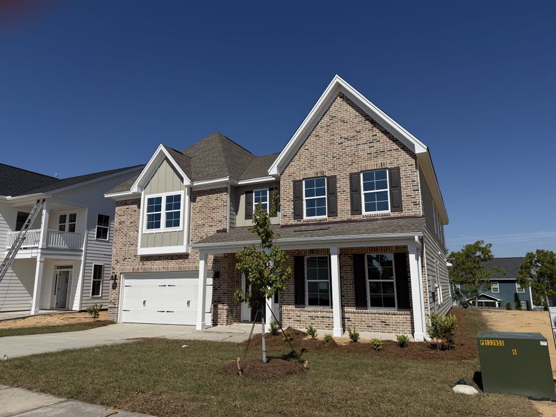 Front exterior of a new home in Gates at Windermere, Blythewood, SC, highlighting curb appeal (Image 1). Front exterior of a new home in Gates at Windermere, Blythewood, SC, highlighting curb appeal (Image 1).