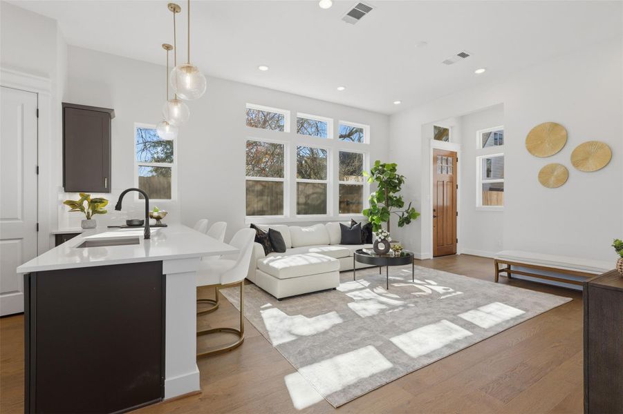 Experience modern elegance in this bright living space, featuring sleek finishes, abundant natural light, and an inviting open layout perfect for entertaining or relaxing. Experience modern elegance in this bright living space, featuring sleek finishes, abundant natural light, and an inviting open layout perfect for entertaining or relaxing.