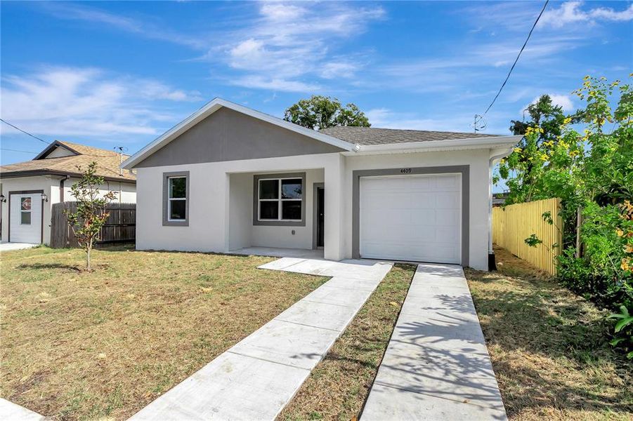 Front exterior of a new home in , Tampa, FL, highlighting curb appeal (Image 1). Front exterior of a new home in , Tampa, FL, highlighting curb appeal (Image 1).