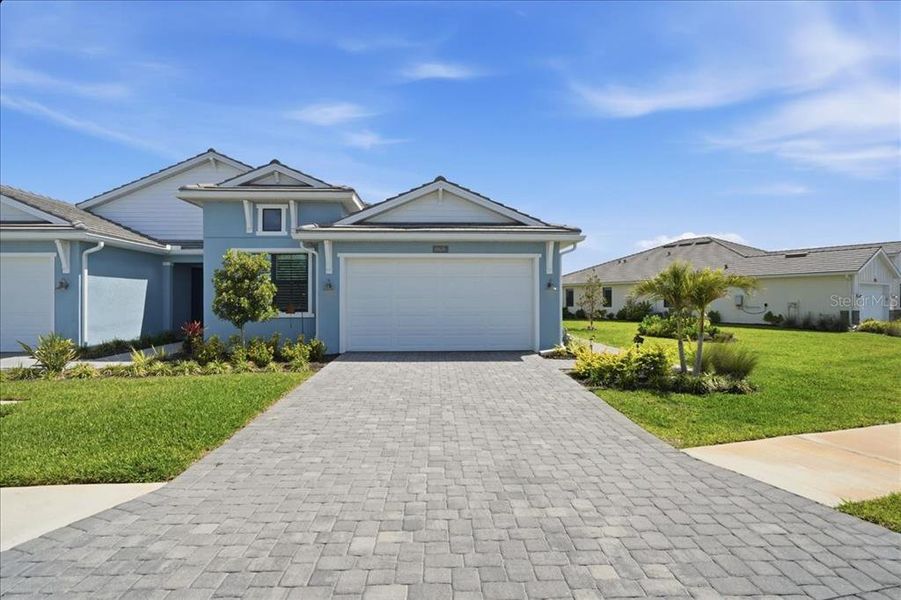 Front exterior of a new home in , Venice, FL, highlighting curb appeal (Image 21).