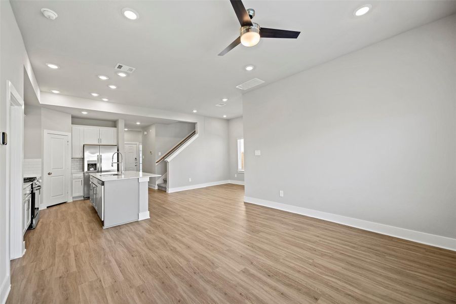 Spacious open-concept family room designed for gathering and relaxation.