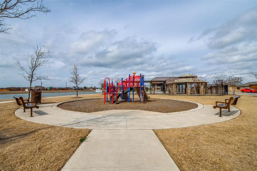 Community jungle gym with a lawn