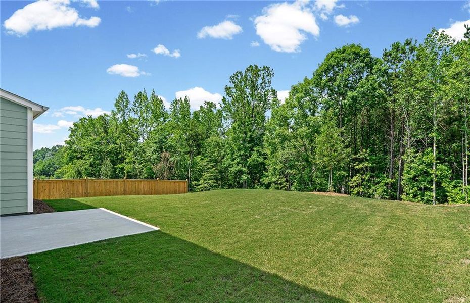 Exterior details and patio area of a home in Hunters Creek, Flowery Branch (Image 20).