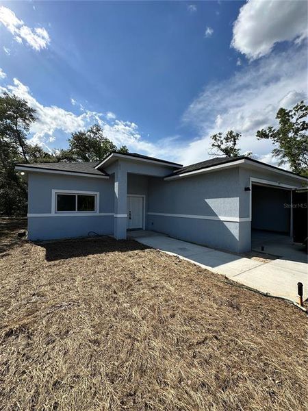Front exterior of a new home in , Ocklawaha, FL, highlighting curb appeal (Image 1). Front exterior of a new home in , Ocklawaha, FL, highlighting curb appeal (Image 1).