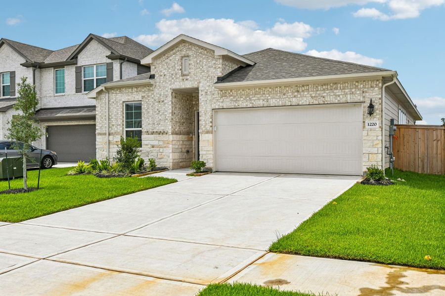 Front exterior of a new home in Riviera Pines - Premier Series, Huffman, TX, highlighting curb appeal (Image 23).